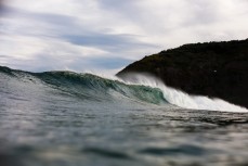 New swell brings clean lines and waves on dusk at St Clair, Dunedin, New Zealand.