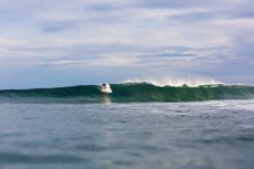 Homer makes the most of a new swell and waves on dusk at St Clair, Dunedin, New Zealand.