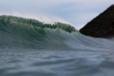 New swell brings clean lines and waves on dusk at St Clair, Dunedin, New Zealand.