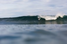 Sean Minhinnick enjoys a new swell, clean lines and waves on dusk at St Clair, Dunedin, New Zealand.