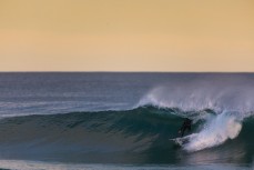 Jack McLeod finds a hollow right in afternoon waves at St Kilda, Dunedin, New Zealand.