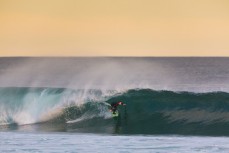 Elliott Brown finds a barrel in fun afternoon waves at St Kilda, Dunedin, New Zealand.
