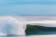 Fun afternoon waves at St Kilda, Dunedin, New Zealand.