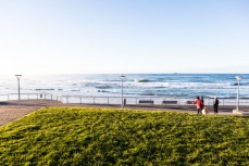 Morning walkers on the Esplanade at St Clair, Dunedin, New Zealand.