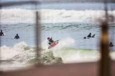 James Murphy takes flight in rampy waves at St Clair, Dunedin, New Zealand.