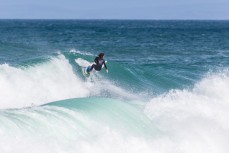 Elliott Brown turns off the top of a wave at St Kilda, Dunedin, New Zealand.