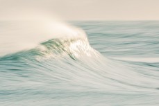 Slow-shutter captures lazy spring waves at Blackhead Beach, Dunedin. 