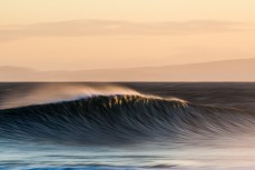 Feathering spring waves in the offshore winds at Blackhead Beach, Dunedin, New Zealand.