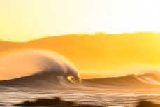 Feathering spring waves in the offshore winds at Blackhead Beach, Dunedin, New Zealand.