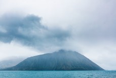 Rain cloaks the mountains above Lake Ohau, New Zealand.