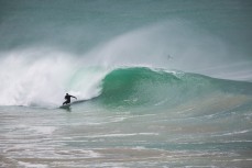 Jamie Gordon revels in solid conditions at a remote beach break in the Catlins, Otago, New Zealand.