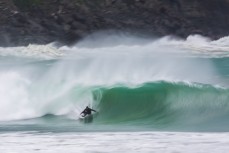 Davy Wooffinden pulls in in solid conditions at a remote beach break in the Catlins, Otago, New Zealand.