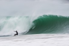 Jamie Gordon relishes solid conditions at a remote beach break in the Catlins, Otago, New Zealand.
