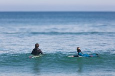 Rising grom Lewis Murphy with his dad Luke making the most of glassy waves at St Kilda, Dunedin, New Zealand.