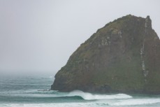 Waves refract into a sheltered corner on the Otago Peninsula, Dunedin, New Zealand.