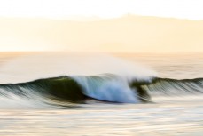 Spring winds airbrush a ground swell at Blackheaqd Beach, Dunedin, New Zealand.