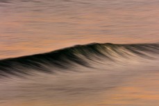 Spring winds airbrush a ground swell at Blackheaqd Beach, Dunedin, New Zealand.