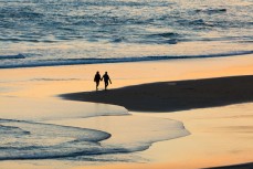 Sunset romance at St Kilda Beach, Dunedin, New Zealand. 