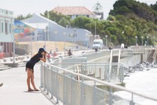 Photographer working the angles at St Clair, Dunedin, New Zealand.