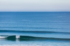 A surfer grans a rail at St Kilda, Dunedin, New Zealand.