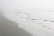 A heavy sea fog rolls into St Clair, Dunedin, New Zealand.