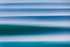 Clean, empty waves during a raw ground swell at St Kilda, Dunedin, New Zealand.