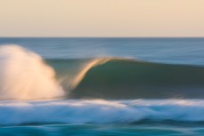 Clean, empty waves during a raw ground swell at St Kilda, Dunedin, New Zealand.
