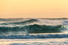 Motion blurred waves on dusk at St Kilda, Dunedin, New Zealand.