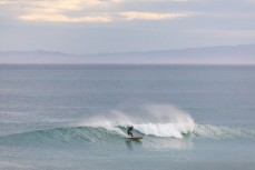Greg Page harvesting the last of the swell at St Kilda, Dunedin, New Zealand.