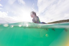 Taya Morrison (12) shows patience in lazy summer waves at Blackhead Beach, Dunedin, New Zealand.