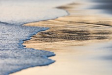 Gold plated sand at St Kilda, Dunedin, New Zealand.