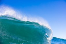 An empty peak on a sun-drenched dawn session at Blackhead Beach, Dunedin, New Zealand. 