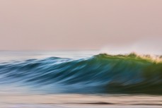 Stormy waves roll through at Kuri Bush, Dunedin, New Zealand.