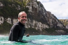 Surfers make the most of waves at a remote beach in the Catlins, Southland, New Zealand.