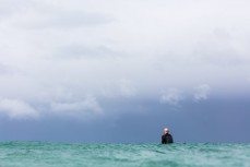 Surfers make the most of waves at a remote beach in the Catlins, Southland, New Zealand.