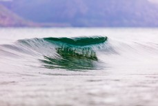 A glassy peak about to break on Lake Wakatipu, Queenstown, Central Otago, New Zealand.