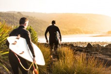 Brett and Derek heading for a wave at Raglan, Waikato, New Zealand.