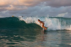 Local girl Shaye, finds a runner at Snapper Rocks near Coolangatta on the Gold Coast, Queensland, Australia.