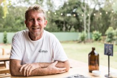 Legendary surf photographer Ted Grambeau takes some time out at a cafe on the Gold Coast, Queensland, Australia.