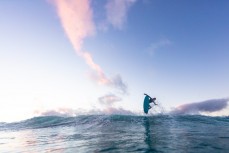 Joe Palmer takes flight in clean waves on a cold winter ground swell at St Kilda, Dunedin, New Zealand.