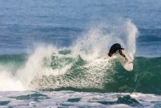 Dale Hunter on his backhand in small fun winter waves at Blackhead, Dunedin, New Zealand. 