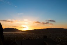 Winter sun rising directly over the Otago Harbour, Dunedin, New Zealand. 