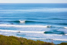 Lineup of small fun winter waves at Blackhead, Dunedin, New Zealand. 