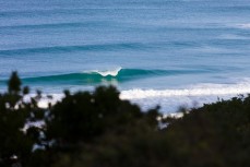 Lineup of small fun winter waves at Blackhead, Dunedin, New Zealand. 