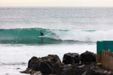 Artist Simon Kaan lining up a barrel in a small winter swell at St Clair, Dunedin, New Zealand. 