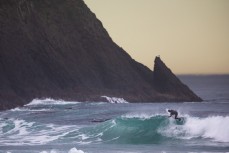 Lyndon Fairbairn spinning his wheels in a winter swell at Blackhead Beach, Dunedin, New Zealand.