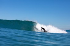 Graham Carse leans into clean glassy waves at Blackhead, Dunedin, New Zealand.