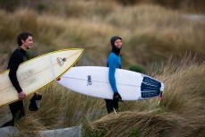 Sorrel all smiles as she heads for a fun winter swell at Aramoana, Dunedin, New Zealand.Credit: www.boxoflight.com/Derek Morrison