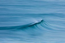 Clean, glassy waves at Blackhead, Dunedin, New Zealand.