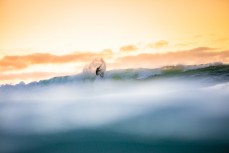 Nat Hughes at home in Manu Bay on dusk at Raglan, Waikato, New Zealand.